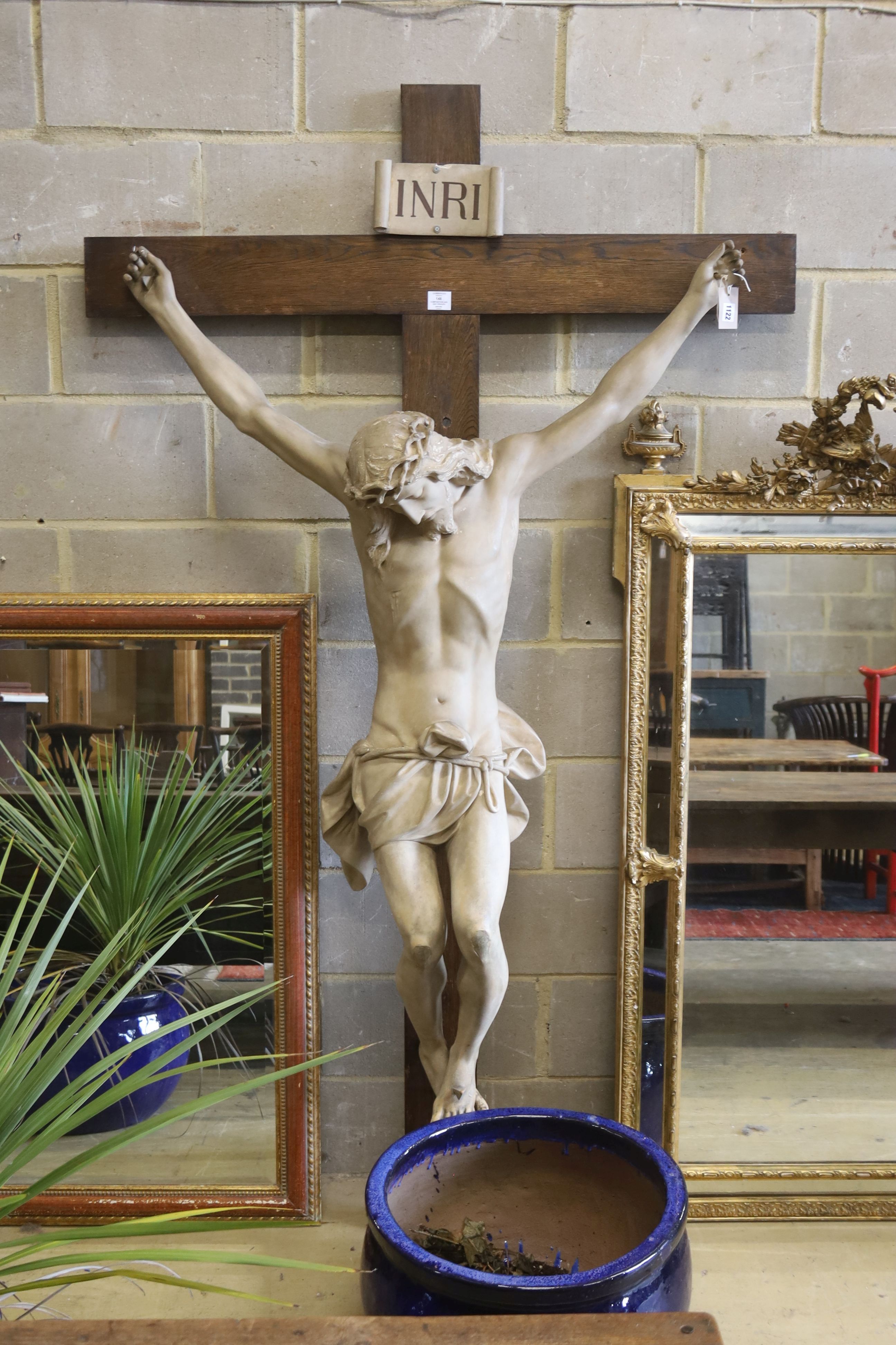 A large composition and oak crucifix, width 126cm, height 218cm